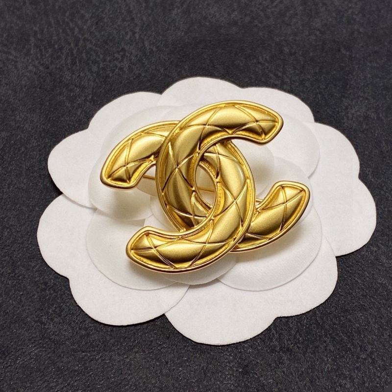 Ch*el brooches